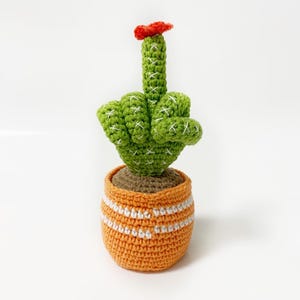 Cactus with middle finger, stuffed plant in the pot