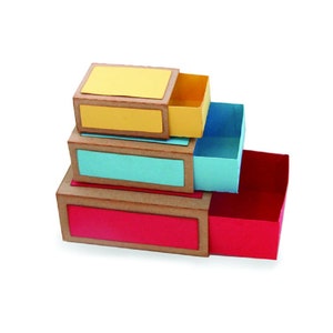 May include: A set of three stacked boxes with sliding drawers. The top box is yellow, the middle box is blue, and the bottom box is red.