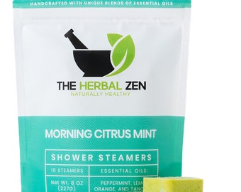 May include: A white bag with a green and blue design. The bag contains 10 shower steamers with essential oils of peppermint, lemon, orange, and tangerine. The bag is labeled "The Herbal Zen" and "Morning Citrus Mint Shower Steamers".