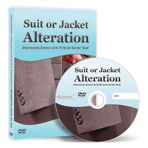 May include: DVD case with a blue background and the text "Suit or Jacket Alteration: Shortening Sleeve with Mitered Corner Vent". The DVD case has a picture of a suit jacket sleeve with buttons. The DVD itself has a similar design with the text "Suit or Jacket Alteration: Shortening Sleeve with Mitered Corner Vent".