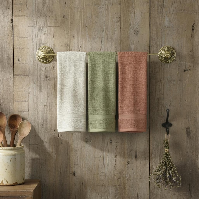 Solid brass towel bar holding multiple towels wall mounted bathroom