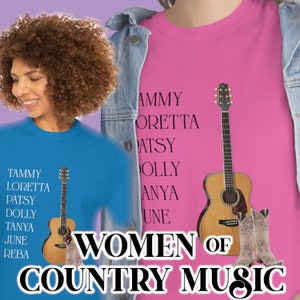 May include: Two women wearing blue and pink t-shirts with the text "Women of Country Music" and a list of female country music singers. Each shirt features a brown acoustic guitar and a pair of brown cowboy boots.