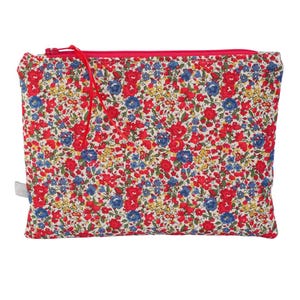 May include: A rectangular pouch with a floral pattern, featuring red, blue, and yellow flowers on a cream background. It has a bright pink zip and pull. The pouch is designed for storage.