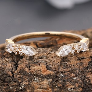 Elevate your jewelry collection with our beautiful Resizable Stacking Rings for Women. Expertly crafted from 18k solid gold, this minimalist band features a stunning moissanite that sparkles like a diamond, making it the perfect choice for a wedding ring band or everyday wear.