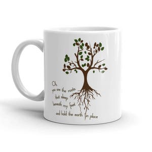 May include: White ceramic mug with a brown tree illustration and the text "Oh, you are the roots that sleep beneath my feet and hold the earth in place".