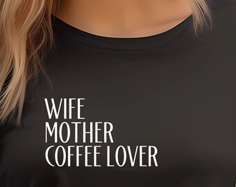 May include: A black t-shirt with the text "Wife Mother Coffee Lover" in white lettering. The shirt is being worn by a person with long blonde hair.