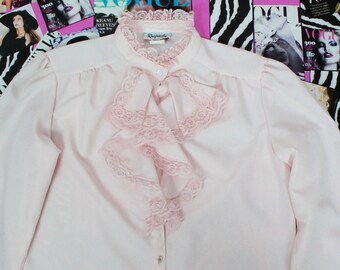 pink frilly blouse