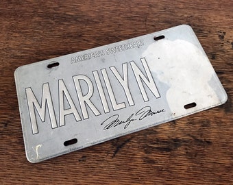 Marilyn Monroe License Plate, vintage find, very faded.  Embossed tin, slightly warped.