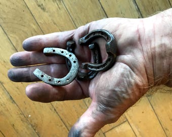 one CAST IRON miniature Horseshoe, approx. under 2" tall, welds to anything steel.
