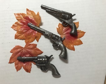 one STEEL miniature Gun, Remington, Navy Colt, Colt, approx. 4" to 5" long, welds to anything steel.