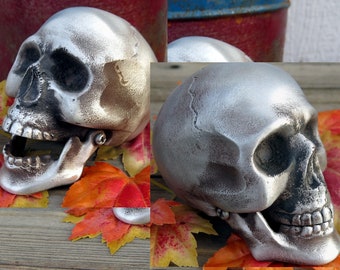 Skull Hood Ornament, cast aluminum, with moveable jaw, and bolt on bottom. Flat or shiny finish..
