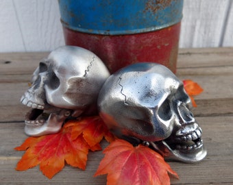 Skull Hood Ornament, cast aluminum, with moveable jaw, and bolt on bottom. Flat or shiny finish..
