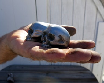 one STEEL, Very Small 1/2 Front Skull Hood Ornament, with bolt on back.  1.5" wide.