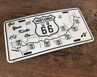 Route 66 License Plate, vintage find.  Embossed tin, slightly warped.