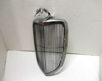 Ford '34, Greyhound Dog cast aluminum ornament on 1/3 scale steel grill,  11" long, 6.5" wide.