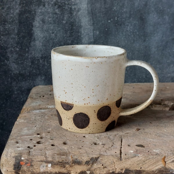 Dotted stoneware cup