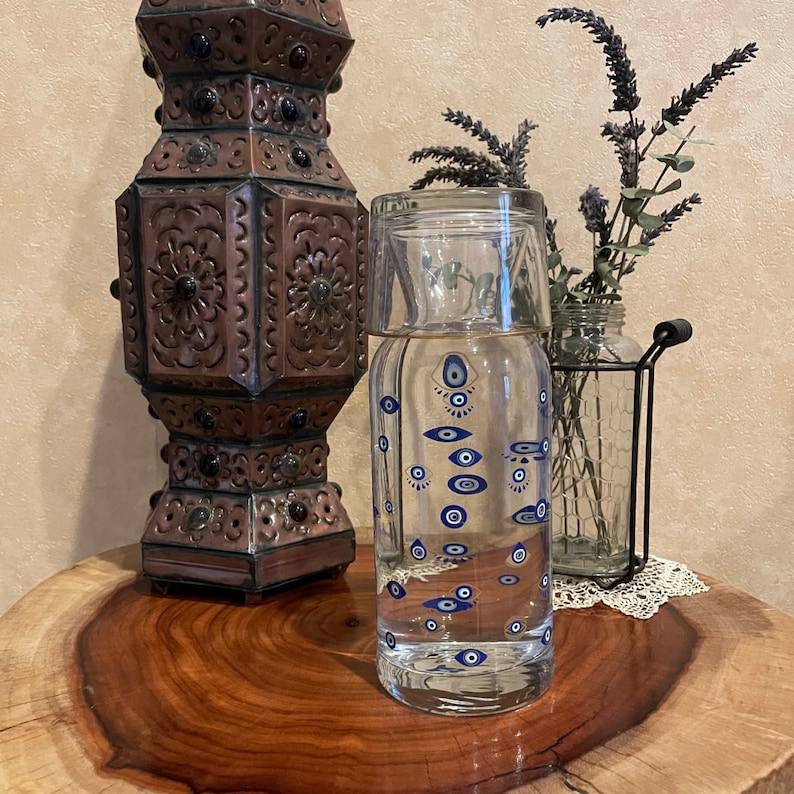 Bedside Water Carafe with evil eye pattern on night side table