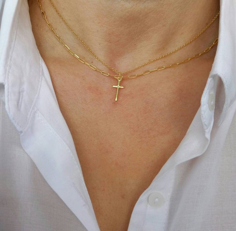 Model wearing A brilliant 14k gold filled layered necklace set, combined from a 14k gold filled link chain necklace and a shinny cross necklace. 
Length approx. 16 inches - can be adjusted upon request.