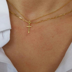 Model wearing A brilliant 14k gold filled layered necklace set, combined from a 14k gold filled link chain necklace and a shinny cross necklace. 
Length approx. 16 inches - can be adjusted upon request.