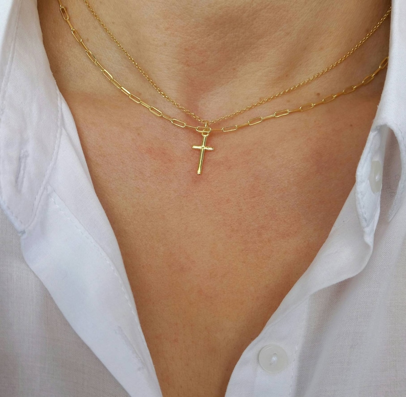 Model wearing A brilliant 14k gold filled layered necklace set, combined from a 14k gold filled link chain necklace and a shinny cross necklace. 
Length approx. 16 inches - can be adjusted upon request.