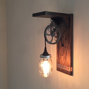 Rustic Steampunk wall light, mason jar, pulley, and Edison bulb with a shelf.  Farmhouse or steampunk-style