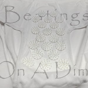 May include: White underwear with a row of small, white, circular, spiked massage nodules.