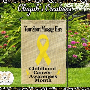 May include: A yellow ribbon garden flag with the text "Your Short Message Here" at the top, a larger yellow ribbon in the center, and the text "Childhood Cancer Awareness Month" at the bottom.