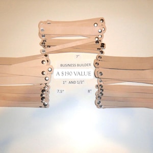 May include: Several stacks of light brown leather wristbands with silver-colored rivets. The text "BUSINESS BUILDER" and "A $190 VALUE" are visible. Measurements are 7", 7.5", and 8" long, and 1" and 1/2" wide.