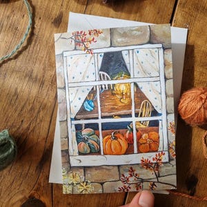 Carte de voeux « Fenêtre de récolte » - illustration de citrouille confortable - art populaire d'automne
