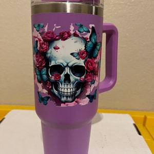 40oz  stainless steel tumbler with roses, butterflies and a skull