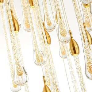 Ferraro pendants in Clear glass with Gold particles. High Ceiling Design Idea