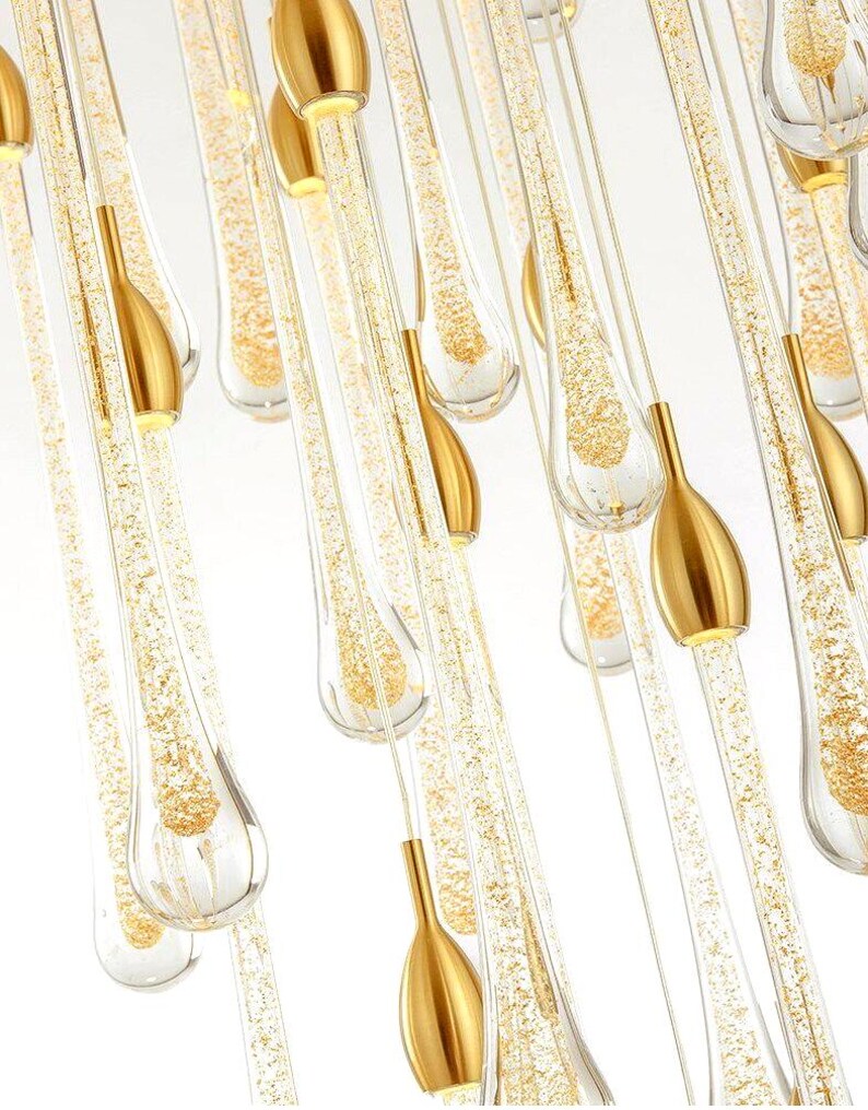 Ferraro pendants in Clear glass with Gold particles. High Ceiling Design Idea