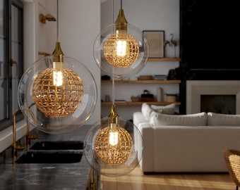 3 Hand-Blown Glass Globe Pendant | Clear, Amber, or Grey. Webbed Glass Globe Pendant with two Large and one Medium glass globe.