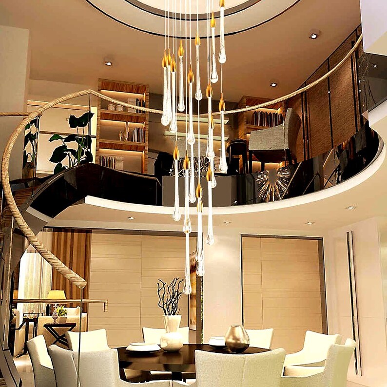 Modern Ferraro Chandelier in Clear glass with Silver particles over dining table on round canopy above dining table. High Ceiling Design Idea
