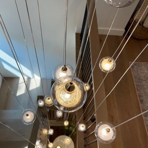 Multi-Level Foyer Chandelier and Modern Pendant Lighting Artisanal Blown Glass. Double Bubble Design Clear and Colored Glass Light Fixture.