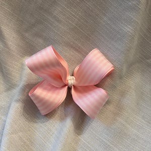 Pink and white striped bow