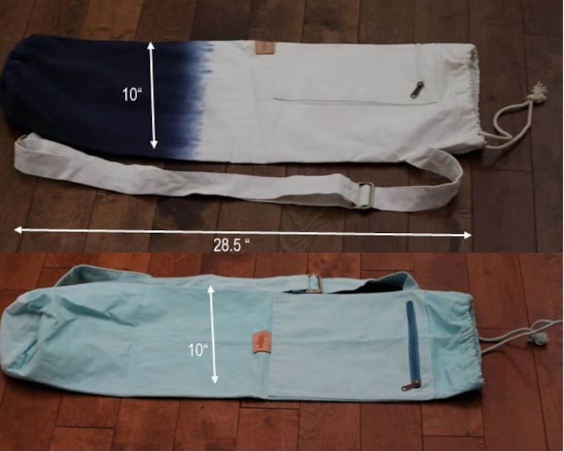 May include: Two yoga mat bags, one with a blue and white ombre design and the other a light blue color. Both bags have a zippered pocket and a drawstring closure. The bags measure 10 inches wide and 28.5 inches long.