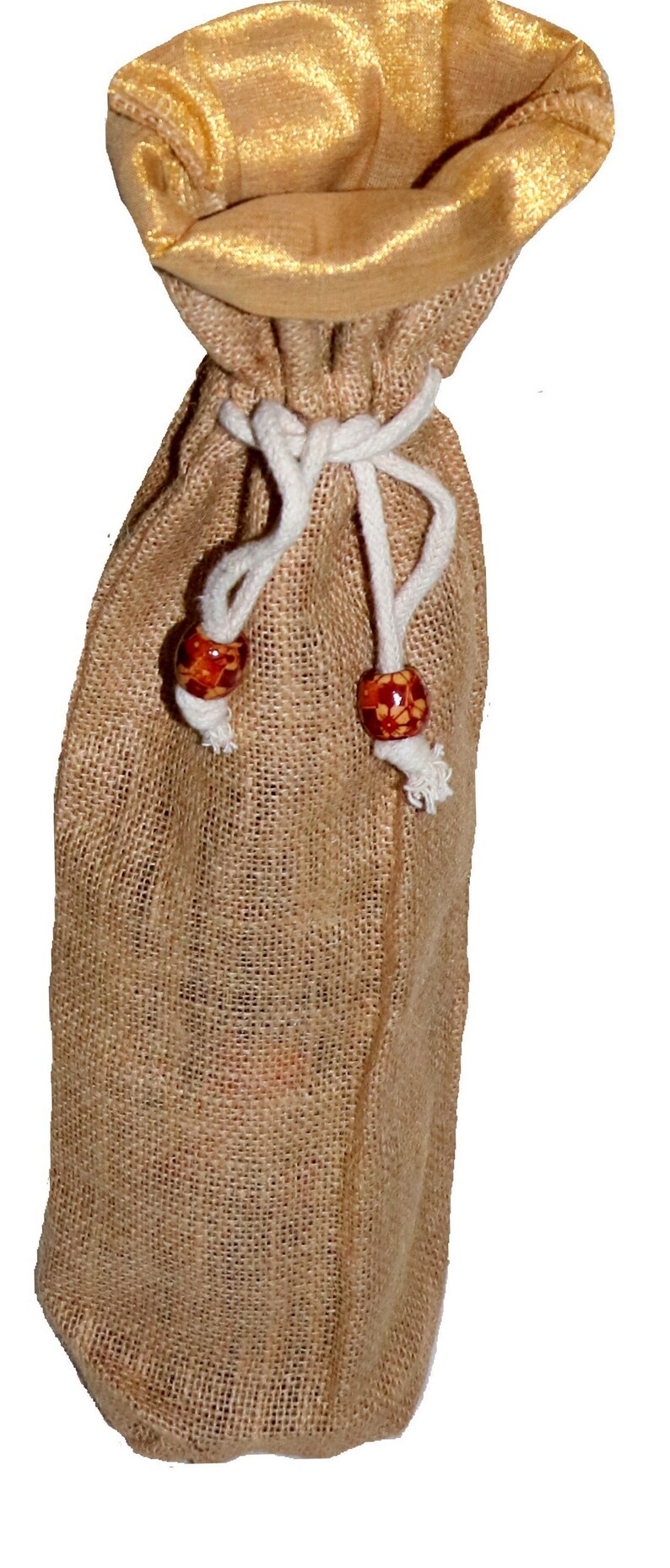 May include: A brown burlap wine bottle bag with a gold satin lining and white drawstrings with wooden beads.
