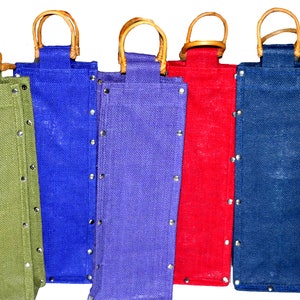 May include: Set of seven canvas wine bottle carriers with bamboo handles. The carriers are in various colours: green, olive green, blue, purple, red, navy blue, and black.