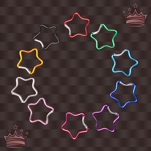 May include: A selection of star-shaped keyrings in a variety of colours, including red, green, blue, and purple. The keyrings are made of metal and have a shiny finish. The image is set against a brown background.