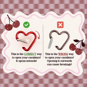 May include: Two heart-shaped carabiners with text instructions. The left red carabiner shows the correct inward opening method with a green checkmark. The right brown carabiner shows the incorrect outward opening method with a red X.