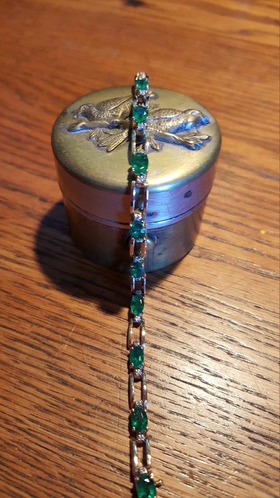 Yellow gold, emerald, and diamond bracelet