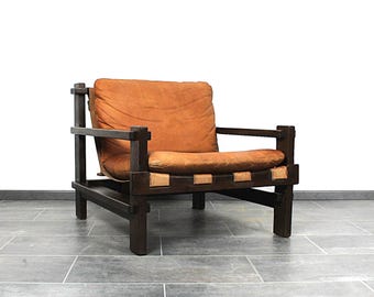 Excellent brutalist club chair in cognac leather by Carl Straub