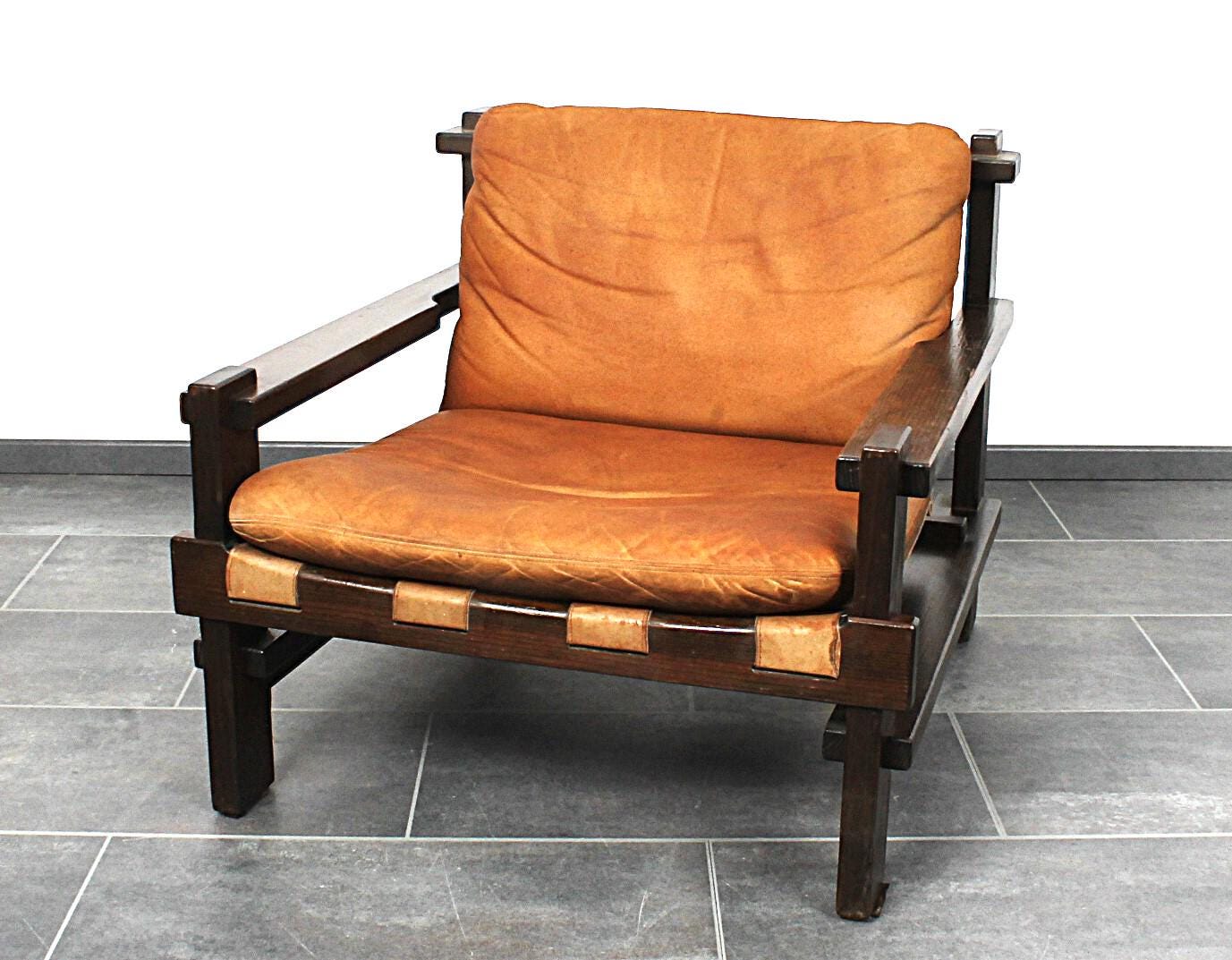 Excellent brutalist club chair in cognac leather by Carl Straub