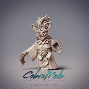May include: A beige miniature figure of a mythical creature with a detailed mask, robe, and a bow. The figure has a stylized design with intricate details. The text "CobralMode Miniatures" and "cobramode.com" are visible at the bottom.