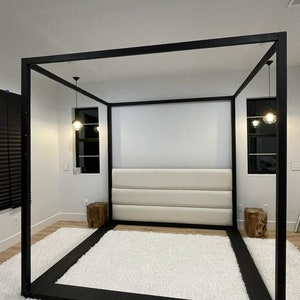 ZEIN  contemporary canopy bed with padded headboard.