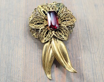 Vintage Gold Tone Metal Art Deco Flower Brooch With Filigree Petals, Repoussé Leaves, Red Rhinestone, Possibly Czech 1930s–1940s