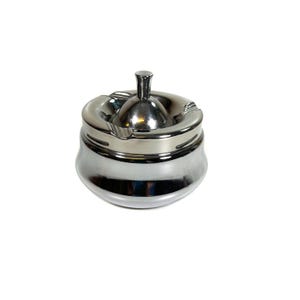 May include: A polished chrome spinning ashtray with a rounded base and a central knob. The top lid features three integrated notches for resting items, and the metallic surface reflects light, creating a smooth, reflective, and shiny appearance.