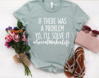 May include: A light blue t-shirt with the text "If there was a problem yo, I'll solve it #SocialWorkerLife" printed in white.