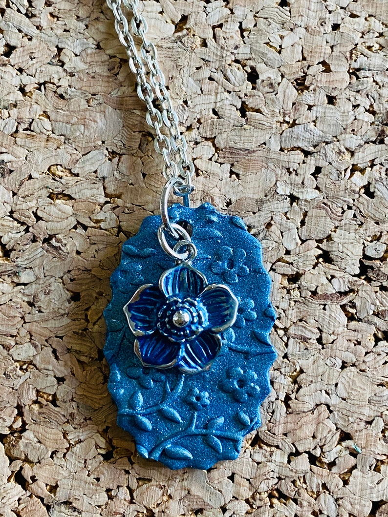 Blue flower stamped clay necklace